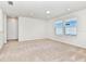 Large, bright bonus room features neutral carpet, recessed lighting and plenty of natural light at 3320 Lilac Way, Davenport, FL 33897