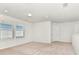 Spacious bonus room offers neutral colors and a light and airy feel at 3320 Lilac Way, Davenport, FL 33897