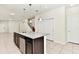 Modern kitchen with granite counters, stainless appliances, and a center island with sink at 3320 Lilac Way, Davenport, FL 33897