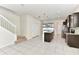 Modern kitchen with dark cabinetry, granite counters, stainless steel appliances, and a center island at 3320 Lilac Way, Davenport, FL 33897