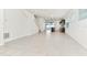 Bright open-concept living area with tile flooring, recessed lighting and slider leading to the pool at 3320 Lilac Way, Davenport, FL 33897