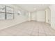 Spacious living area with tiled floors and several large windows providing natural light at 3320 Lilac Way, Davenport, FL 33897