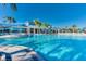 Spacious community pool with plenty of seating and umbrellas for a relaxing day outdoors at 3320 Lilac Way, Davenport, FL 33897