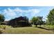 Spacious backyard featuring a screened-in patio and gazebo, perfect for outdoor entertaining at 3655 Seminole Dr, Orlando, FL 32812