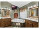 Well-appointed bathroom features a luxurious tub, dual sinks, and ample counter space at 3655 Seminole Dr, Orlando, FL 32812