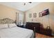 Comfortable bedroom with a vaulted ceiling, ample natural light, a television, and tasteful decor at 3655 Seminole Dr, Orlando, FL 32812