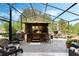 The gazebo in the screened-in patio offers a relaxing space for outdoor dining and lounging at 3655 Seminole Dr, Orlando, FL 32812
