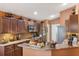 Well-appointed kitchen with granite countertops, stainless steel appliances, and ample cabinet space at 3655 Seminole Dr, Orlando, FL 32812