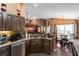 Modern kitchen with granite countertops, ample counter space, and an open view into the living and dining areas at 3655 Seminole Dr, Orlando, FL 32812