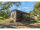 Charming exterior view featuring a screened-in porch and natural surroundings at 3901 Villas Green Cir # 1, Longwood, FL 32779