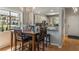 Dining area featuring a wood table with a window view and modern lighting at 3901 Villas Green Cir # 1, Longwood, FL 32779