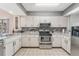 Functional kitchen featuring stainless steel appliances and durable granite countertops at 3901 Villas Green Cir # 1, Longwood, FL 32779