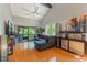 Bright living room with hardwood floors, vaulted ceilings and a peaceful view at 3901 Villas Green Cir # 1, Longwood, FL 32779