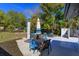 Backyard with multiple seating areas and a grill at 427 Zimmerman Dr, Orlando, FL 32839