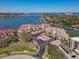 Stunning aerial view of the condominium complex with waterfront views and covered parking at 434 Bouchelle Dr # 202, New Smyrna Beach, FL 32169