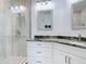 Modern bathroom featuring a glass shower and granite countertops at 434 Bouchelle Dr # 202, New Smyrna Beach, FL 32169
