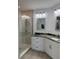 Updated bathroom featuring granite countertops, modern fixtures, and a large, tiled walk-in shower at 434 Bouchelle Dr # 202, New Smyrna Beach, FL 32169