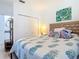Bright bedroom with closet and decorative accents at 434 Bouchelle Dr # 202, New Smyrna Beach, FL 32169