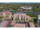 Aerial shot of a condo building with parking and boat slips, showcasing water views and convenient waterfront living at 434 Bouchelle Dr # 202, New Smyrna Beach, FL 32169