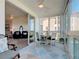 Bright and airy lanai offers cozy seating and a table, seamlessly connecting indoor and outdoor living spaces at 434 Bouchelle Dr # 202, New Smyrna Beach, FL 32169