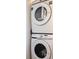Convenient, stacked washer and dryer, perfect for saving space in your new home at 434 Bouchelle Dr # 202, New Smyrna Beach, FL 32169