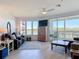 Open concept living room featuring gorgeous flooring, comfortable seating, and serene water views at 434 Bouchelle Dr # 202, New Smyrna Beach, FL 32169