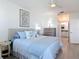 Serene main bedroom with stylish decor, a comfortable bed, and an ensuite bathroom at 434 Bouchelle Dr # 202, New Smyrna Beach, FL 32169