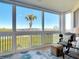 Relaxing sun room with comfortable seating offering stunning water views and bright natural light at 434 Bouchelle Dr # 202, New Smyrna Beach, FL 32169