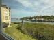 Beautiful water view from the condo overlooking the harbor, bridge and lush landscaping at 434 Bouchelle Dr # 202, New Smyrna Beach, FL 32169