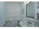 A bright bathroom featuring a window with white shutters, providing natural light and a fresh ambiance at 476 Zelda Blvd, Daytona Beach, FL 32118