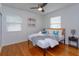 Bright bedroom with a modern bed frame, wood floors and marine themed decorations at 476 Zelda Blvd, Daytona Beach, FL 32118