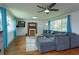 Comfortable living room featuring hardwood floors, large windows with great natural light, and stylish décor at 476 Zelda Blvd, Daytona Beach, FL 32118