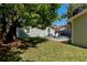 Backyard with mature tree, chairs, and outdoor area at 5108 Sunrise Blvd, Orlando, FL 32803