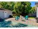 Backyard features seating area and a large tree offering shade at 5108 Sunrise Blvd, Orlando, FL 32803