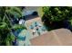 An aerial view of a backyard firepit with landscaping and several seating options at 5108 Sunrise Blvd, Orlando, FL 32803