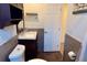 Bathroom featuring a vanity, toilet, and decorative wall accents at 5108 Sunrise Blvd, Orlando, FL 32803