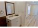 Bathroom with vanity and mirror, stone counters and view to bedroom with natural light at 5108 Sunrise Blvd, Orlando, FL 32803