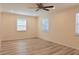 Bedroom with light wood floors has lots of light from three windows at 5108 Sunrise Blvd, Orlando, FL 32803