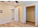 Bedroom features light wood floors, closet, and adjoining room at 5108 Sunrise Blvd, Orlando, FL 32803