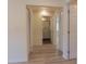 Hallway with tile floors leading to bathroom with shower and sliding door closet at 5108 Sunrise Blvd, Orlando, FL 32803