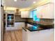 Beautiful renovated kitchen with stainless steel appliances and eat in bar area at 5108 Sunrise Blvd, Orlando, FL 32803