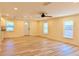 Well-lit living room featuring wood floors and bright yellow walls at 5108 Sunrise Blvd, Orlando, FL 32803
