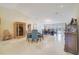 Open-concept dining space featuring tile floors, recessed lighting, and two dining tables at 5170 Ne 64Th Ave, Silver Springs, FL 34488