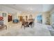 Open dining area featuring tile floors, traditional dining furniture, and neutral walls at 5170 Ne 64Th Ave, Silver Springs, FL 34488