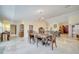 Elegant dining area featuring tile floors and decorative lighting at 5170 Ne 64Th Ave, Silver Springs, FL 34488