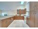 Bright kitchen with granite countertops, light wood cabinetry, and modern appliances at 5170 Ne 64Th Ave, Silver Springs, FL 34488