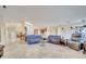 Spacious living room featuring travertine floors, lots of natural light, and comfortable furniture at 5170 Ne 64Th Ave, Silver Springs, FL 34488