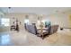 Bright living room features neutral paint, tile flooring, and a charming white fireplace at 5170 Ne 64Th Ave, Silver Springs, FL 34488