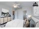 This virtually staged bedroom is spacious and bright, complemented by neutral colors and stylish decor at 6612 S Goldenrod Rd # 104A, Orlando, FL 32822