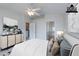 Bright bedroom with a ceiling fan and staged furniture, artwork, and decor at 6612 S Goldenrod Rd # 104A, Orlando, FL 32822